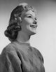 Close-up poster print of a young woman smiling, showcasing joy and positivity.