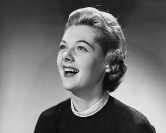 Close-up poster print of a young woman laughing, showcasing joy and happiness.