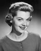 Portrait of a young woman smiling poster print showcasing joy and warmth.