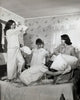 Four teenage girls having a fun pillow fight poster print
