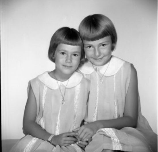 Two Young Sisters Poster Print showcasing childhood bond.