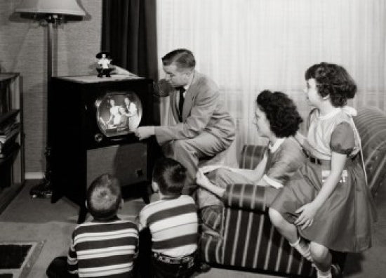 Parents with three children watching television poster print