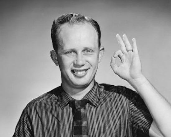 Businessman making an OK sign poster print