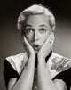 Surprised mid adult woman poster print showcasing genuine emotion.