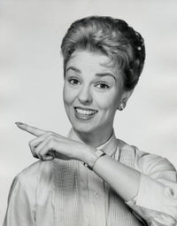 Portrait of a mid adult woman smiling and pointing her finger poster print.