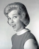 Woman smiling over shoulder poster print, vibrant and cheerful artwork.