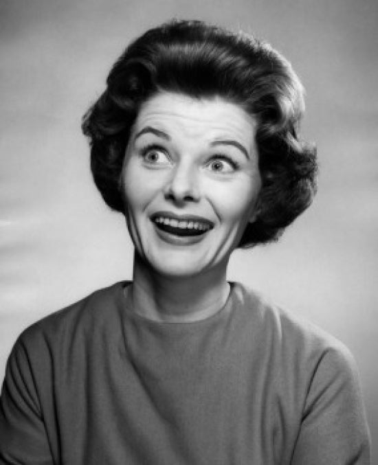 Surprised Woman Smiling Poster Print showcasing vibrant colors and cheerful expression.