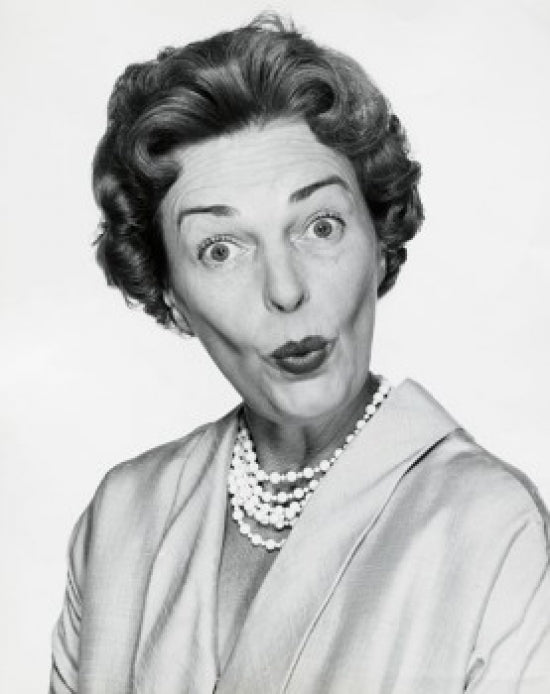 Portrait of a mid adult woman puckering her lips poster print