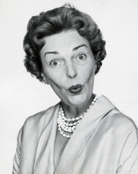 Portrait of a mid adult woman puckering her lips poster print