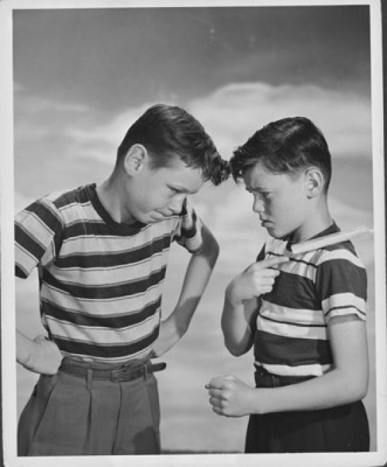 Boy daring another boy to knock a chip off his shoulder poster print.