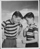 Boy daring another boy to knock a chip off his shoulder poster print.