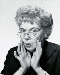 Portrait of a senior woman puckering her lips, poster print