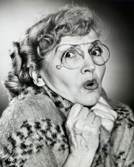 Portrait of a Senior Woman Looking Scared Poster Print showcasing emotional depth and expression.