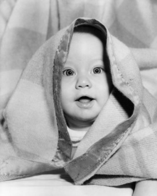 Portrait of Baby Under Blanket Poster Print, perfect for nursery decor.