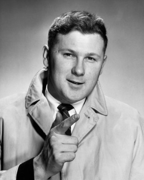 Portrait of a businessman in an overcoat smiling poster print.