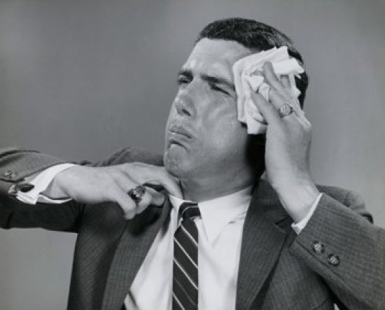 Close-up poster of a businessman wiping his face with a handkerchief