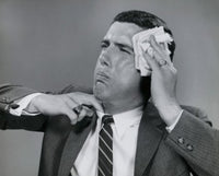 Close-up poster of a businessman wiping his face with a handkerchief