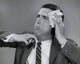 Close-up poster of a businessman wiping his face with a handkerchief