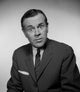 Studio portrait of businessman frowning, poster print.