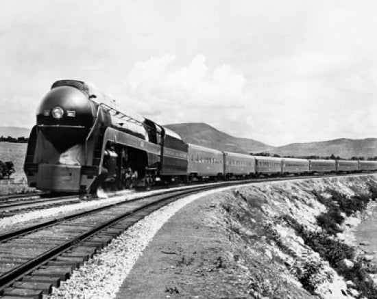 Train on a Railroad Track Poster Print showcasing a majestic train on a railroad track.