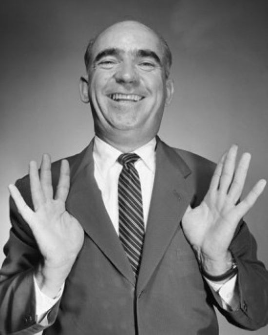 Studio portrait of a smiling businessman poster print.