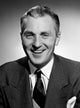 Studio portrait of a smiling businessman - Poster Print