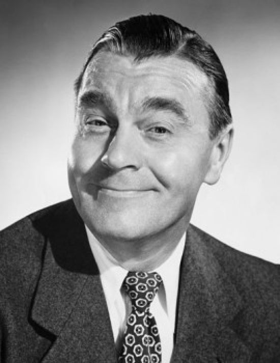 Portrait of a mature man smirking poster print