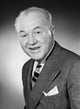 Studio portrait of a smiling businessman poster print.