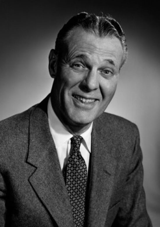 Studio portrait of a smiling businessman, professional decor for office or home.