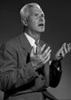Studio portrait of a man gesturing poster print