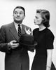 Young woman pointing at a man poster print available in multiple sizes.