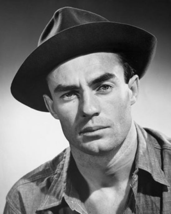 Close-up poster print of a serious young man, emphasizing emotion and depth.