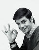 Smiling young man making OK gesture Poster Print