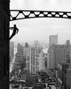 Silhouette of a Window Cleaner Poster Print featuring a worker cleaning windows high above a cityscape.