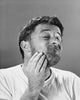 Close-up poster print of a mid-adult man scratching his head.