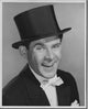 Portrait of a mid-aged man smiling poster print, adding warmth and positivity to any space.