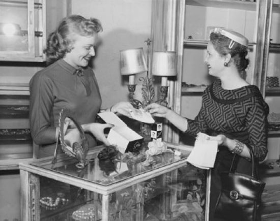 Female sales clerk showcasing jewelry poster print