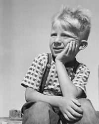 Thoughtful Boy Poster Print featuring a boy with hand on chin