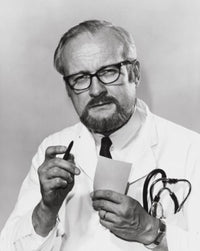 Portrait of a Male Doctor Holding a Pen and Paper Poster Print