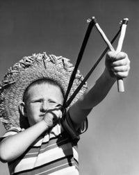 Boy Aiming Slingshot Poster Print showcasing childhood adventure