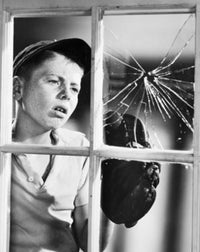 Boy Looking at a Broken Window Pane Poster Print - Evocative childhood imagery
