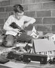 Boy Playing with a Train Set Poster Print