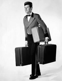 Bellhop Carrying Luggage Poster Print showcasing whimsical travel charm.