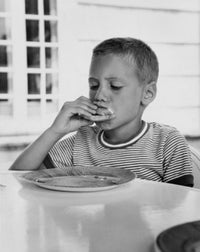 Close-Up of a Boy Having Breakfast Poster Print