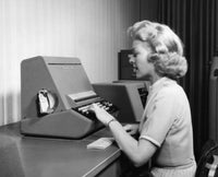Woman using typewriter in office poster print