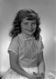 Studio portrait of a girl wearing a dress - Poster Print