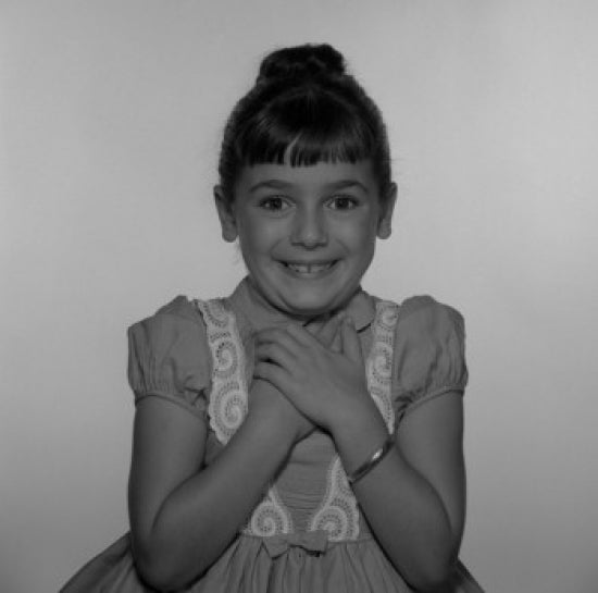 Studio Shot of Girl with Hands on Chest Poster Print