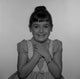 Studio Shot of Girl with Hands on Chest Poster Print