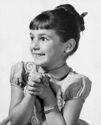 Close-Up of a Girl Smiling Poster Print, showcasing joy and warmth.