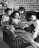 Close-up of a mother reading a storybook with her son and daughter